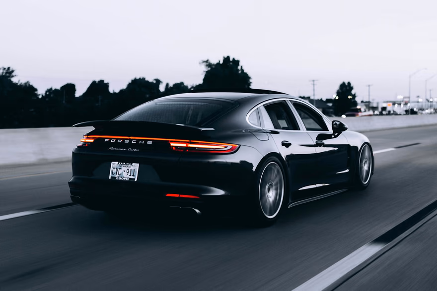Car at speed on the interstate at dusk