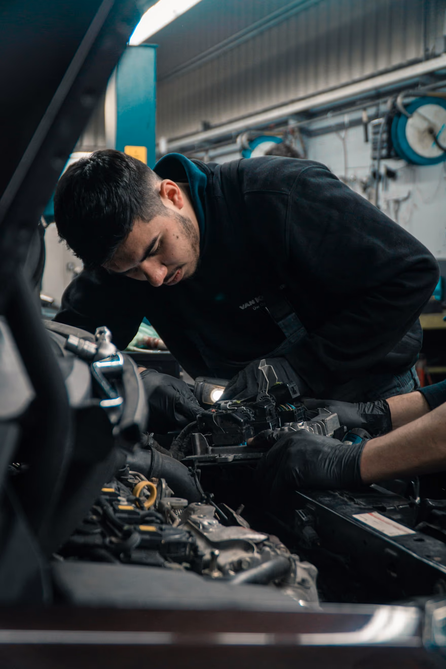 A Grote technician tracing a fault under the hood